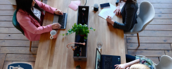 a birds-eye view of three female office workers